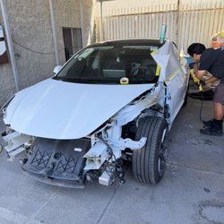 South Bay Auto Collision Inc - Tesla 3 undergoing repairs after a minor fender bender
