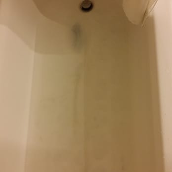 Romer Times Square - Bathtub outdated, scratched, old, motel grade. That is not water, it is stained beyond belief. - Hotels Near Me - New York, New York