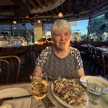 Queen's Raw Bar & Grill - She is enjoying the chopped chicory salad. - Seafood Near Me - Los Angeles, California Queen's Raw Bar & Grill - She is enjoying the chopped chicory salad. - Seafood Near Me - Los Angeles, California