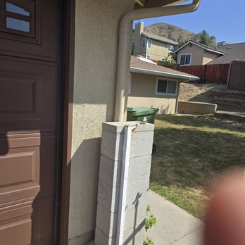 The Rain Gutter Specialists - Water outlet directed down driveway,and protected from receiving damage. - Gutter Services Near Me - Van Nuys, California The Rain Gutter Specialists - Water outlet directed down driveway,and protected from receiving damage. - Gutter Services Near Me - Van Nuys, California