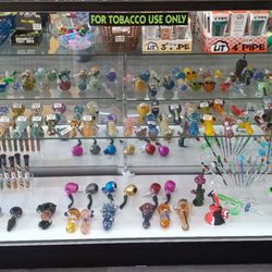 Local and imported glass pieces beautifully blown, wooden and silicone pieces as well.