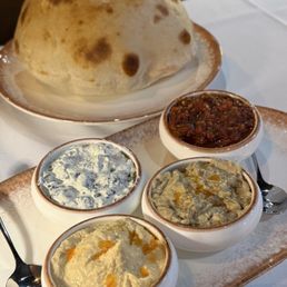 Humans, babaganush, ezme and spinach tarator Humans, babaganush, ezme and spinach tarator