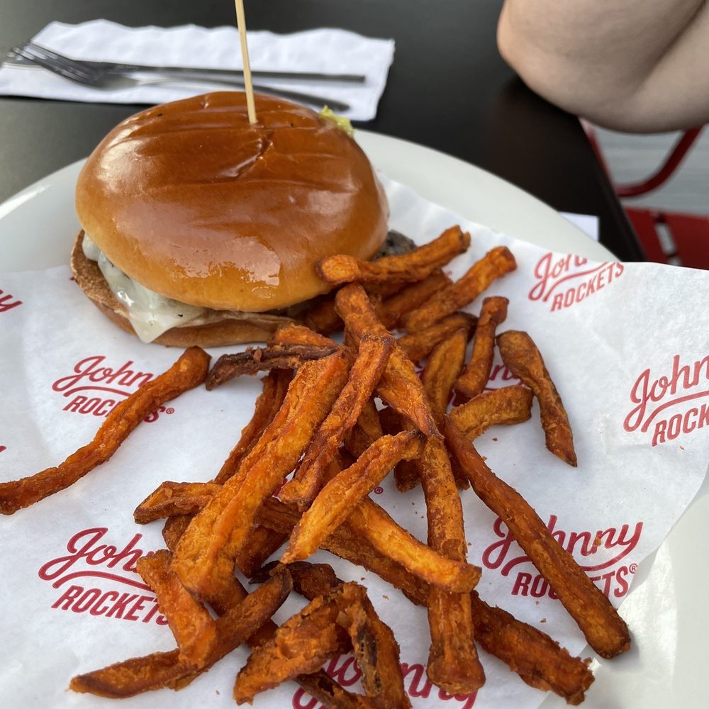 Johnny Rockets - a hamburger and fries on a plate - Burgers Near Me - Queensbury, New York Johnny Rockets - a hamburger and fries on a plate - Burgers Near Me - Queensbury, New York