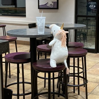 Taco Bell - a stuffed unicorn sitting on a stool in a restaurant - Fast Food Near Me - Stow, Ohio Taco Bell - a stuffed unicorn sitting on a stool in a restaurant - Fast Food Near Me - Stow, Ohio