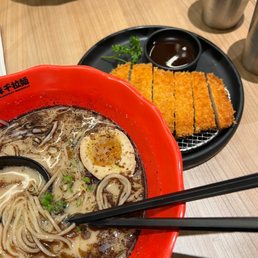 a bowl of ramen with chopsticks a bowl of ramen with chopsticks