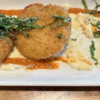 Tupelo Honey Southern Kitchen & Bar - Cousin's appetizer choice: Fried Green Tomatoes on a bed of grits (get them on the side if you prefer) red pepper sauce. - Southern Near Me - Indianapolis, Indiana Tupelo Honey Southern Kitchen & Bar - Cousin's appetizer choice: Fried Green Tomatoes on a bed of grits (get them on the side if you prefer) red pepper sauce. - Southern Near Me - Indianapolis, Indiana