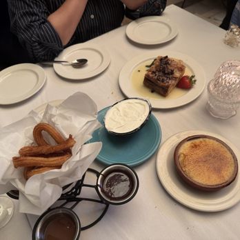 Columbia Restaurant - Our dessert selection: churros, coconut ice cream, white chocolate bread pudding, and crema Catalana - Spanish Near Me - Tampa, Florida Columbia Restaurant - Our dessert selection: churros, coconut ice cream, white chocolate bread pudding, and crema Catalana - Spanish Near Me - Tampa, Florida
