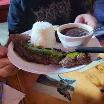 El Ambia Cubano - Churrasco. Skirt steak topped with tangy chimchurri sauce. - Cuban Near Me - Melbourne, Florida El Ambia Cubano - Churrasco. Skirt steak topped with tangy chimchurri sauce. - Cuban Near Me - Melbourne, Florida