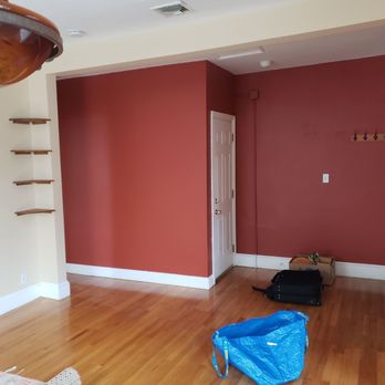 Megios Painting - Bright red wall before - Painters Near Me Megios Painting - Bright red wall before - Painters Near Me