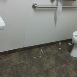 Walgreens - Paper on bathroom floor.
