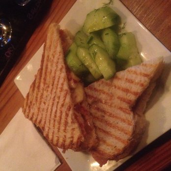 Mullers Cider House - The Elvis (bacon, peanut butter, and banana) on sourdough bread, with a side of cucumber salad. - Bars Near Me - Rochester, New York Mullers Cider House - The Elvis (bacon, peanut butter, and banana) on sourdough bread, with a side of cucumber salad. - Bars Near Me - Rochester, New York