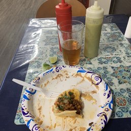 Pork taco on Nearly empty plate.