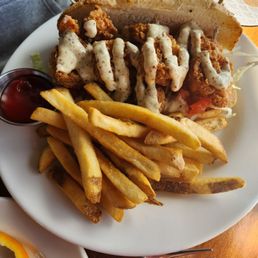 Po boy sandwich - shrimp was fresh but could do without the sauce Po boy sandwich - shrimp was fresh but could do without the sauce