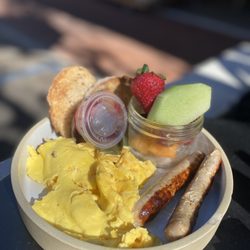 Renaud's Patisserie & Bistro - The American Breakfast: scrambled eggs, chicken sausage, fruit, and multigrain toast