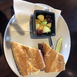 Cellar 19 Wine & Deli - Italian sandwich  with a side of fruit salad.