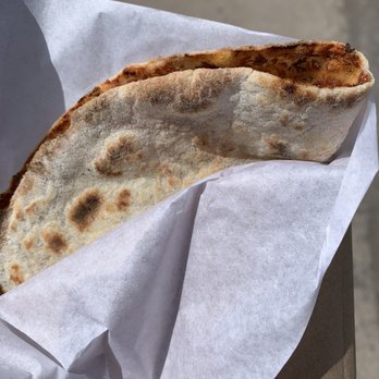 Boulangerie Arax - a hand holding a piece of bread - Mediterranean Near Me - Laval, Quebec Boulangerie Arax - a hand holding a piece of bread - Mediterranean Near Me - Laval, Quebec