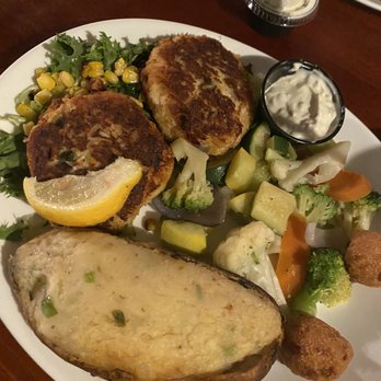 Pompano Joe's - Crab cakes with twice baked potato - Seafood Near Me - Destin, Florida Pompano Joe's - Crab cakes with twice baked potato - Seafood Near Me - Destin, Florida
