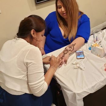 Orchid Threading Salon - The bride getting her henna done by Neha - Threading Services Near Me - Corona, California Orchid Threading Salon - The bride getting her henna done by Neha - Threading Services Near Me - Corona, California