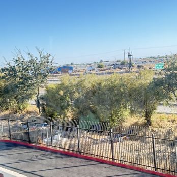 TownePlace Suites by Marriott Merced - Homeless encampment view off sitting area - Hotels Near Me - Merced, California TownePlace Suites by Marriott Merced - Homeless encampment view off sitting area - Hotels Near Me - Merced, California