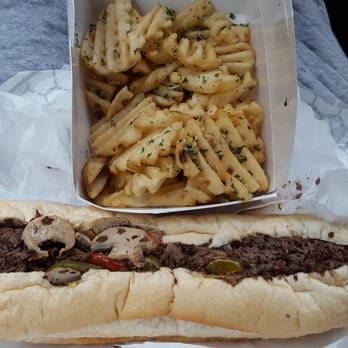 Jake's Steaks - 12" mushroom cheesesteak hot cherry peppers & American cheese. I ordered seasoned curly fries but I think these are garlic fries - Sandwiches Near Me - San Francisco, California Jake's Steaks - 12" mushroom cheesesteak hot cherry peppers & American cheese. I ordered seasoned curly fries but I think these are garlic fries - Sandwiches Near Me - San Francisco, California