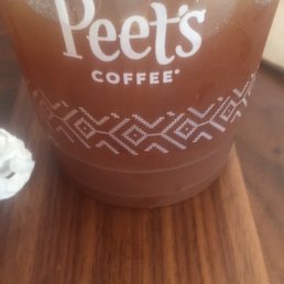 Iced Americano with a splash of almond milk.