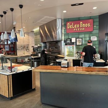 DeLeo Bros Pizza - Live edge serving bar, free smells of garlic knots - Pizza Near Me - Seattle, Washington