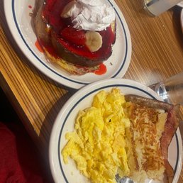 Strawberry French toast with eggs and hash browns. Strawberry French toast with eggs and hash browns.