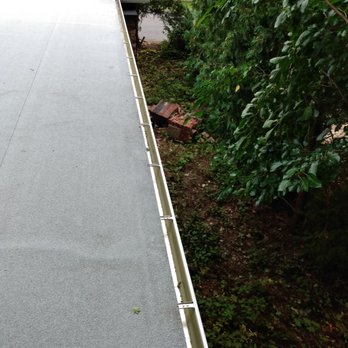 Maynard Roofing - Shot from roof top of nearly the 30ft length of new seamless gutter - Roofing Near Me - Watertown, Connecticut Maynard Roofing - Shot from roof top of nearly the 30ft length of new seamless gutter - Roofing Near Me - Watertown, Connecticut