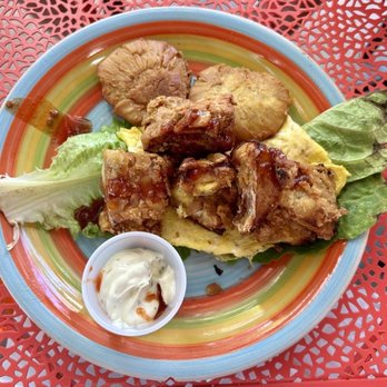 Kristy’s On The Caribe - Fried fish nugget topped eggs with tostones - Breakfast & Brunch Near Me - Vieques, Puerto Rico Kristy’s On The Caribe - Fried fish nugget topped eggs with tostones - Breakfast & Brunch Near Me - Vieques, Puerto Rico