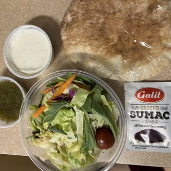 Miraj Healthy Grill - Side Salad, ground sumac, pita, tzatziki sauce and green sauce (spicy!) - Persian/Iranian Near Me - New York, New York Miraj Healthy Grill - Side Salad, ground sumac, pita, tzatziki sauce and green sauce (spicy!) - Persian/Iranian Near Me - New York, New York