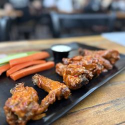 Backdraft Bar & Grill - Wings appetizer w 5150 sauce. Disappointed as they tasted dry and twice cooked.