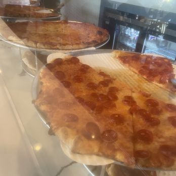 Anthony & Luca's Pizza Kitchen - NY style pizza slices on display, ready to reheat. Deliciously greasy. - Food Delivery Services Near Me - Jersey Village, Texas Anthony & Luca's Pizza Kitchen - NY style pizza slices on display, ready to reheat. Deliciously greasy. - Food Delivery Services Near Me - Jersey Village, Texas