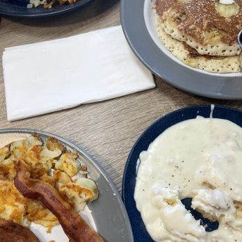 Egg Haus - (4) Bacon and eggs plate with biscuits and gravy Banana pancakes - Breakfast & Brunch Near Me - Orange, California