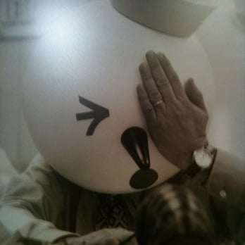 Food4Less - a person holding a balloon with a face drawn on it - Grocery Near Me - Barstow, California
