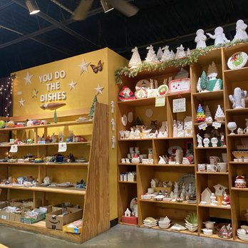 You Do The Dishes - On the left is all the pottery that was painted by people. On the right is entire wall just for Christmas potter to paint. - Arts & Crafts Near Me - Tampa, Florida