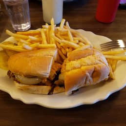 P. R. Wrangler with fries...a cube steak smothered with sauteed onions and mushrooms and coated with melted cheese on a hoagie roll P. R. Wrangler with fries...a cube steak smothered with sauteed onions and mushrooms and coated with melted cheese on a hoagie roll