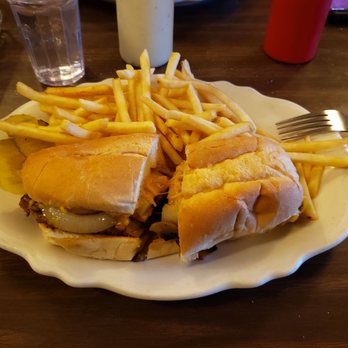 Stockman's Club - P. R. Wrangler with fries...a cube steak smothered with sauteed onions and mushrooms and coated with melted cheese on a hoagie roll - Steakhouses Near Me - Broadus, Montana Stockman's Club - P. R. Wrangler with fries...a cube steak smothered with sauteed onions and mushrooms and coated with melted cheese on a hoagie roll - Steakhouses Near Me - Broadus, Montana