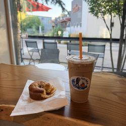 Grindz Coffee Shop - Iced River Roll Latte , orange cranberry muffin