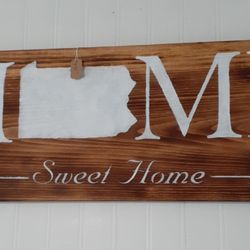 The Primitive Nook - Wooden signs are made on site.
Celebrate where you live.