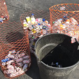 Orange "mesh bins" for for aluminum cans and plastic bottles. Garbage bin is for glass. Orange "mesh bins" for for aluminum cans and plastic bottles. Garbage bin is for glass.