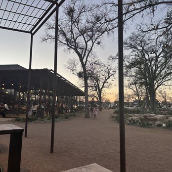 Leona Botanical Cafe & Bar - Sitting at Dee Dee's next to the fountain - Cocktail Bars Near Me - Sunset Valley, Texas Leona Botanical Cafe & Bar - Sitting at Dee Dee's next to the fountain - Cocktail Bars Near Me - Sunset Valley, Texas