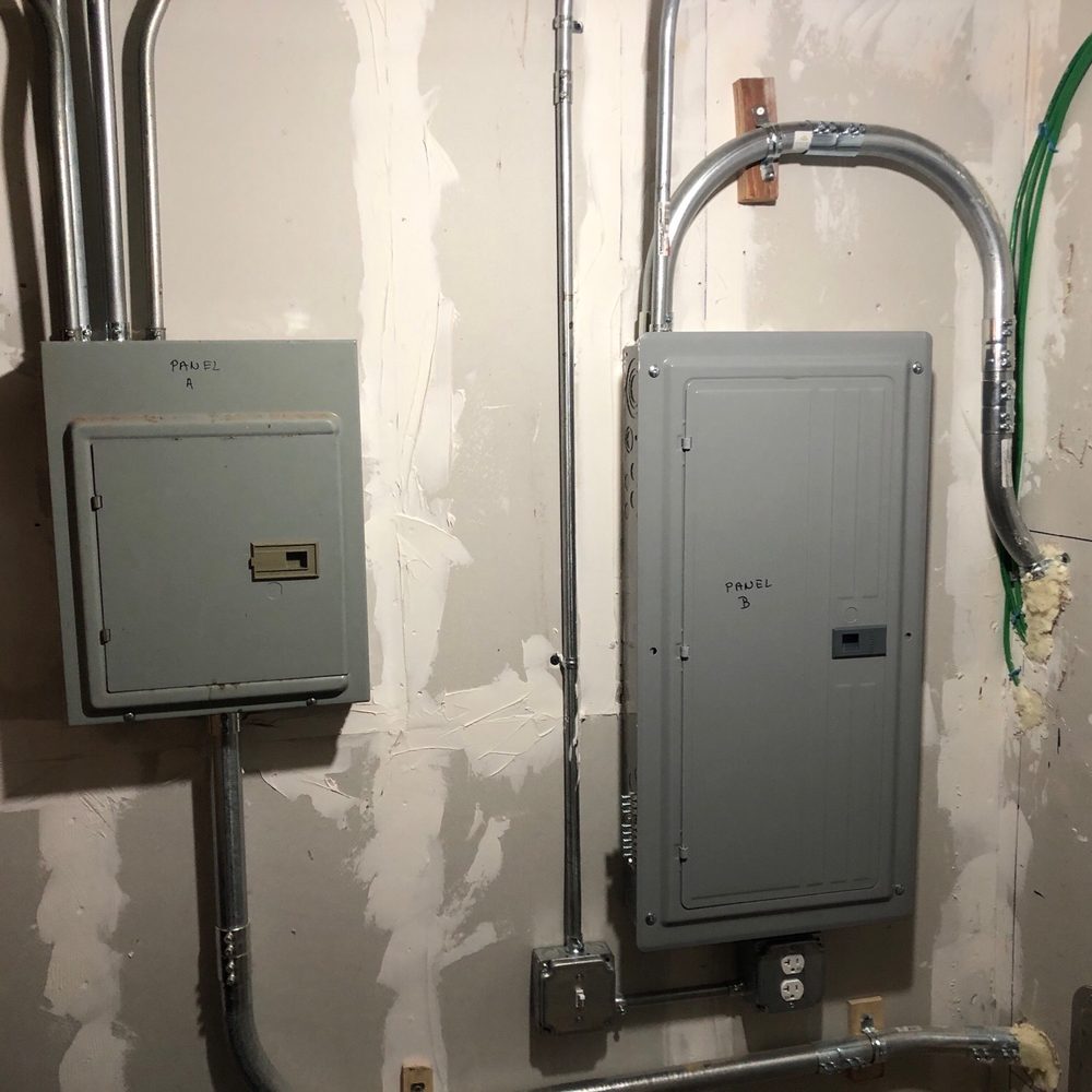 Mabus Electric - Our new 200 amp service. Small panel was existing and now fed from external meter box. Larger panel is new. - Electricians Near Me