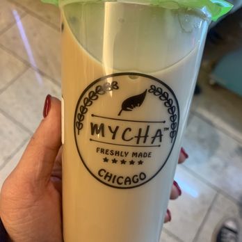 Mycha - a person holding a glass of milk - Coffee & Tea Near Me - Chicago, Illinois