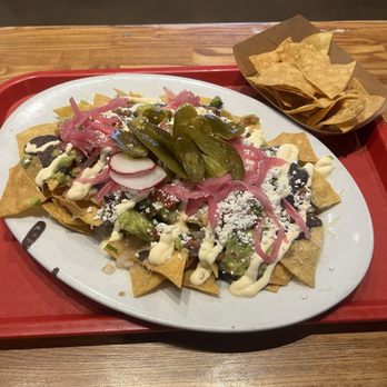 Taqueria Los Mayas - Gigantic nachos enough for 2 maybe even 3 - on Fridays comes with a free Michelada! - Tacos Near Me - San Francisco, California