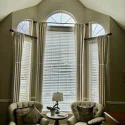 Floor To Window - Elegant Custom Drapery Panels are shown with memory tape to create lasting panel pleats and are removed after 72 hours.