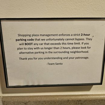 Santo - Parking lot notice in restroom - New Mexican Cuisine Near Me - Boulder, Colorado