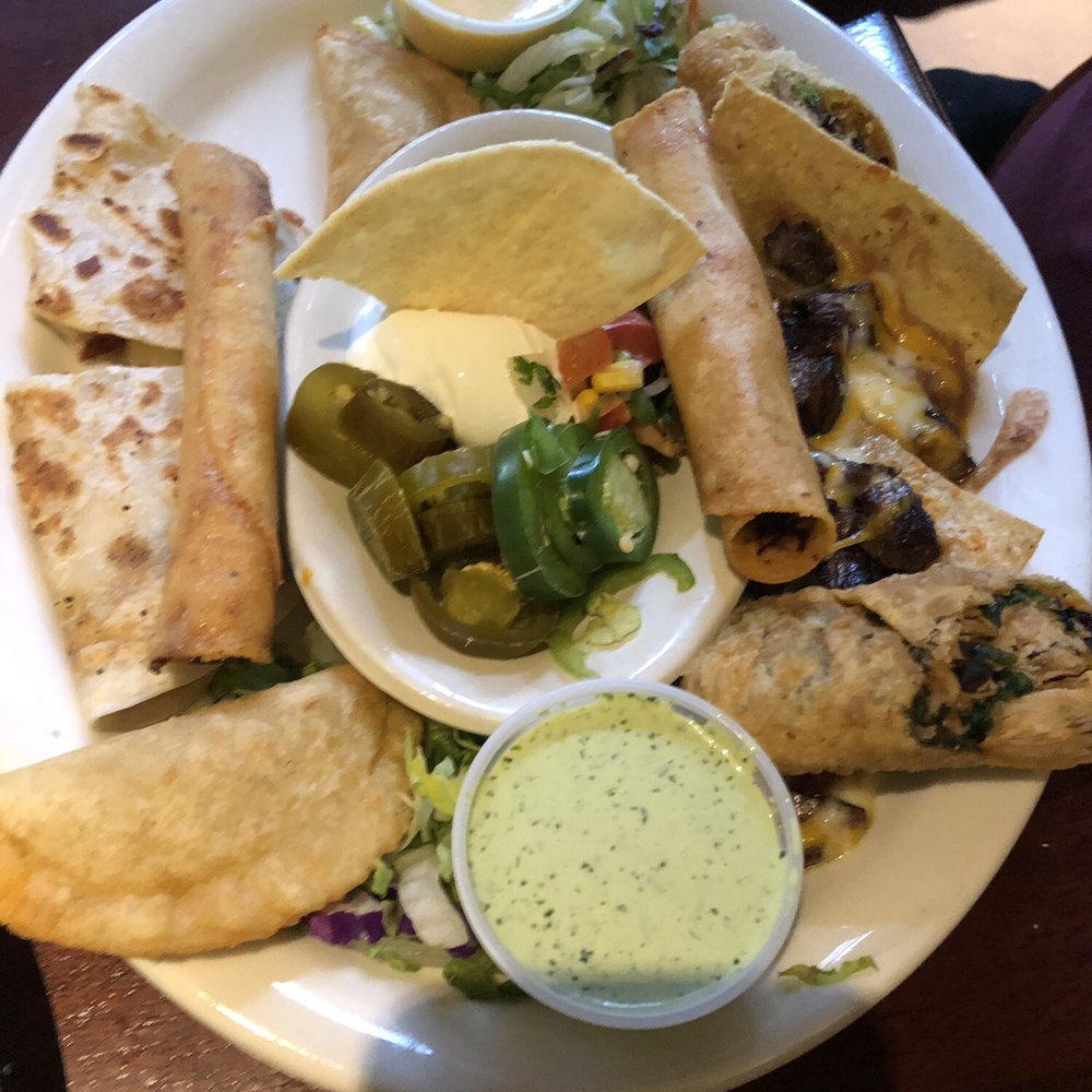 Gringo's Mexican Kitchen - Sampler. This cane lots of little goodies, taqueria, Southwest egg rolls, empanadas, chicken quesadilla and fajita nachos! Yum - Mexican Near Me - Spring, Texas Gringo's Mexican Kitchen - Sampler. This cane lots of little goodies, taqueria, Southwest egg rolls, empanadas, chicken quesadilla and fajita nachos! Yum - Mexican Near Me - Spring, Texas