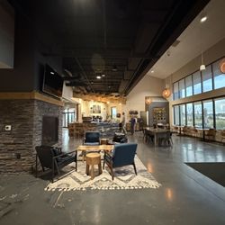 1979 Coffee - Front interior w/ fireplace, couches, window seating & tables, cafe front counter