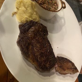 Fahrenheit 132 - Dry-Aged Ribeye (14oz) with Rosemary Mashed Potatoes and Black Eyed Peas - Steakhouses Near Me - Fredericksburg, Virginia