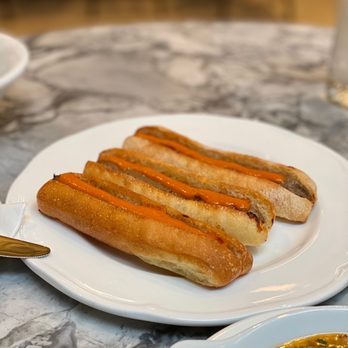 Linh Cafe - a plate of hot dogs and a bowl of soup - Vietnamese Near Me - Vancouver, British Columbia Linh Cafe - a plate of hot dogs and a bowl of soup - Vietnamese Near Me - Vancouver, British Columbia